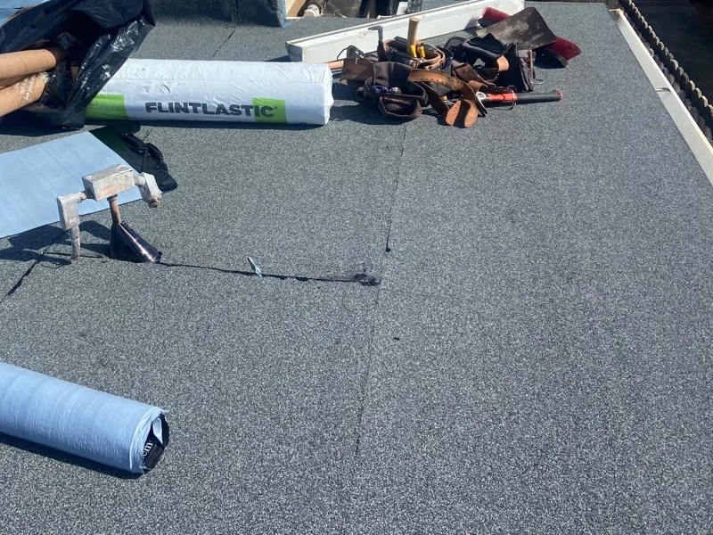 Flat roof project with peel-and-stick roofing rolls